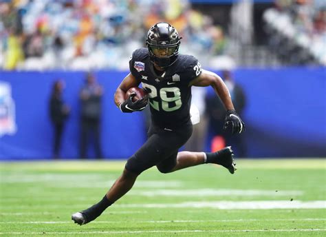 Who are the top 10 running backs in college football